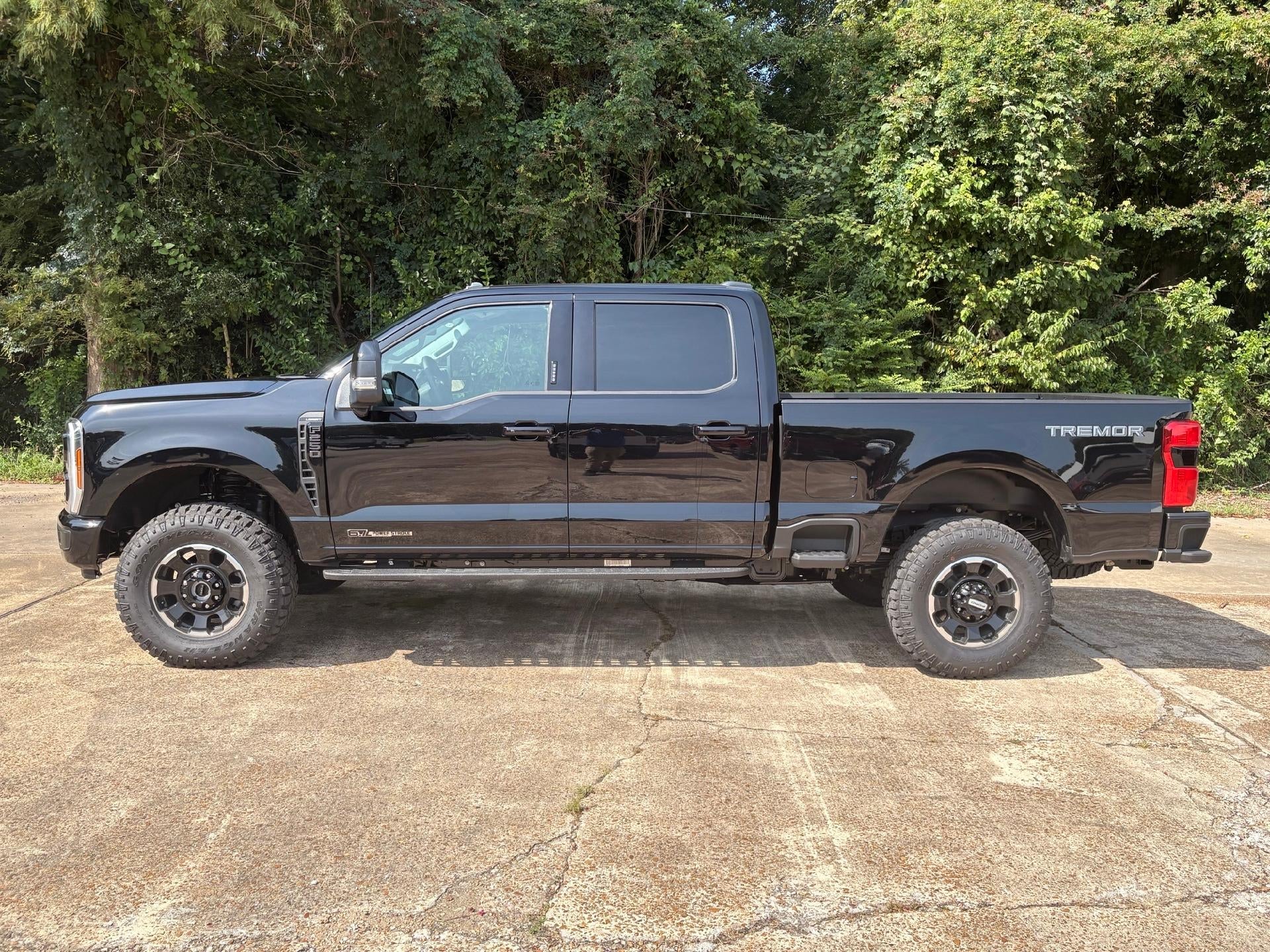 2026 Ford Super Duty F-250 Lariat in Agate Black Metallic — front three-quarter view