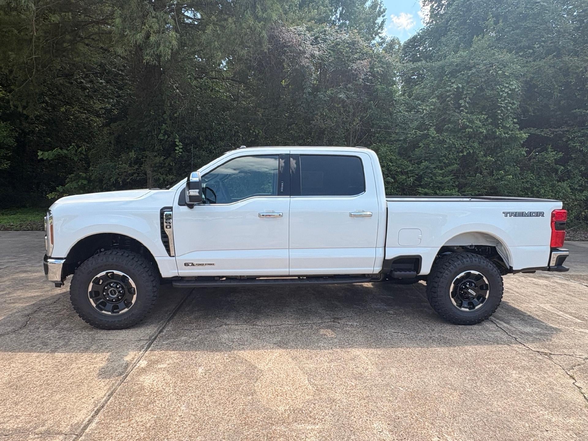 2026 Ford Super Duty F-250 Lariat in Star White Metallic Tri-Coat — front three-quarter view